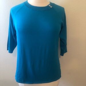 Turquoise sweater with gem accent